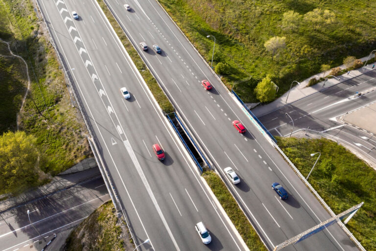 cars driving street aerial view